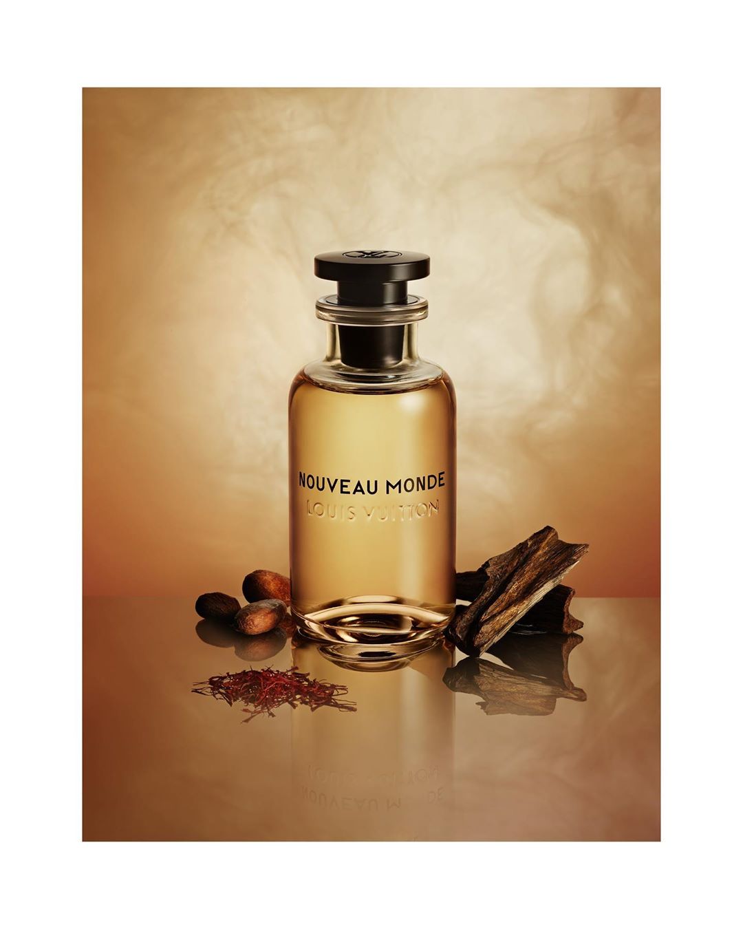 Elegant studio shot of Louis Vuitton fragrance bottle on reflective surface, with cocoa beans and wood accents against a gradient brown backdrop.