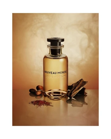 Elegant studio shot of Louis Vuitton fragrance bottle on reflective surface, with cocoa beans and wood accents against a gradient brown backdrop.