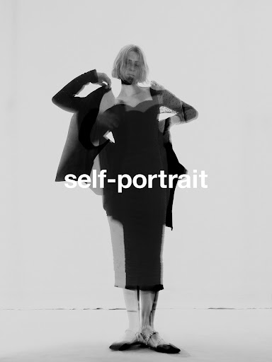 Monochrome portrait of a woman posing against a light background by Nicolas Kern with self-portrait text overlaid