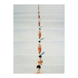 Multiple exposure photography showing a woman running repeatedly across a pale, minimalist landscape in terracotta clothing.