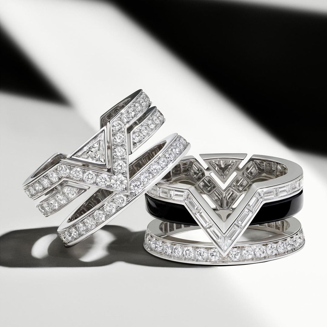 Close-up studio shot of two geometrically shaped diamond rings with black onyx, emphasizing luxury jewelry design, sparkle, and modern elegance.