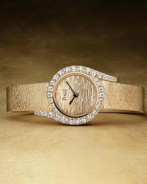 Elegant gold Piaget watch featuring a diamond-encrusted dial, presented against a warm, textured gold background for a luxury appeal.