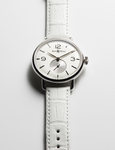 Silver Ball & Ross wristwatch with white crocodile leather strap on a white surface, showcasing luxury timekeeping with Swiss craftsmanship.
