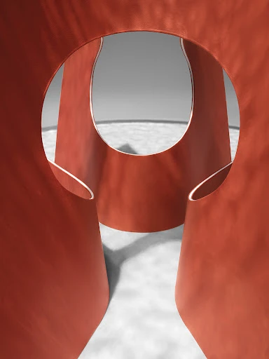Abstract shot of a geometric, rounded, coral-colored sculpture featuring prominent negative space and circular openings against a grey background.