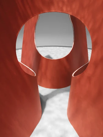 Abstract shot of a geometric, rounded, coral-colored sculpture featuring prominent negative space and circular openings against a grey background.