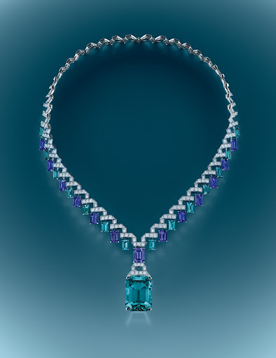 Elegant necklace featuring blue and white gemstones on a teal gradient background, jewellery, close-up product shot for luxury fashion.