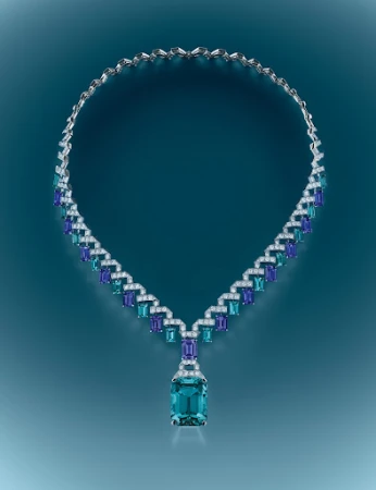 Elegant necklace featuring blue and white gemstones on a teal gradient background, jewellery, close-up product shot for luxury fashion.