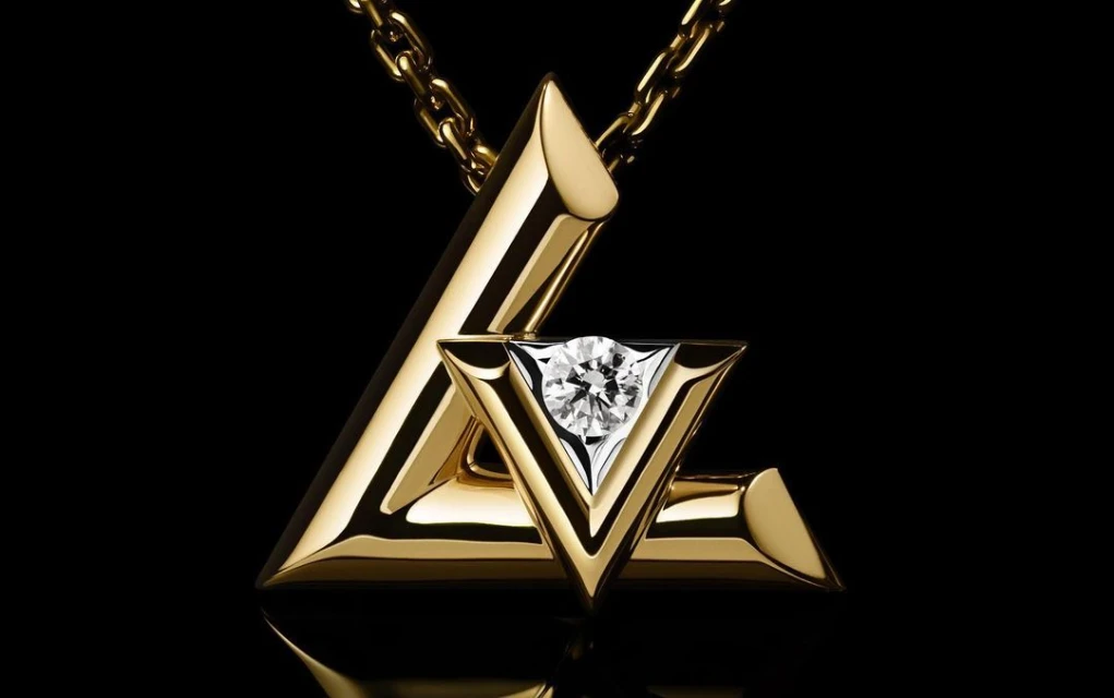 Elegant gold necklace with a diamond pendant, displayed against a black backdrop highlighting its luxurious materials and craftsmanship.