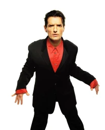 Man wearing a black suit jacket and trousers with a bright red collared shirt against a white background