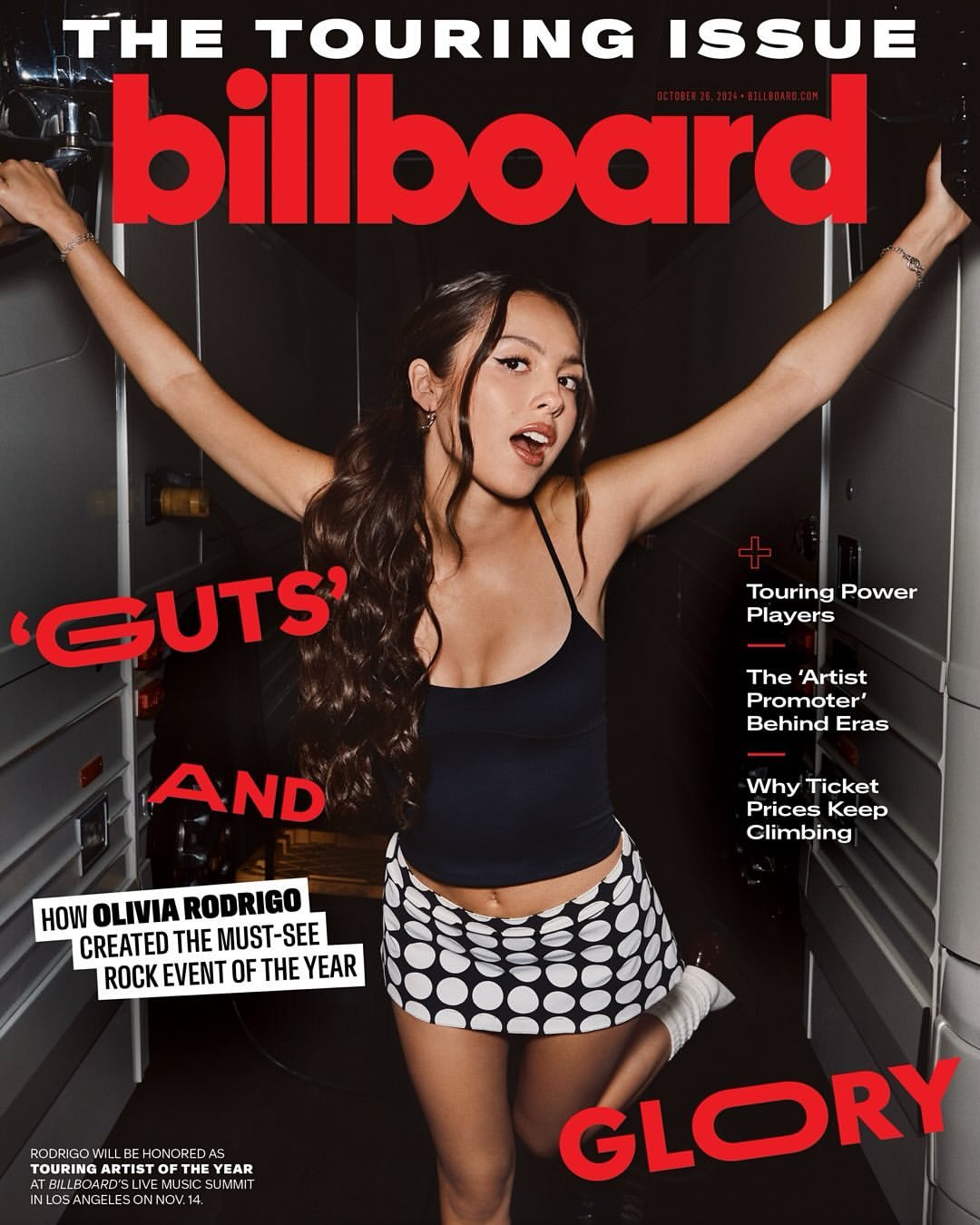 Olivia Rodrigo on Billboard Magazine cover, promoting Guts album, wearing black tank top and polka dot skirt, arms raised, red text.