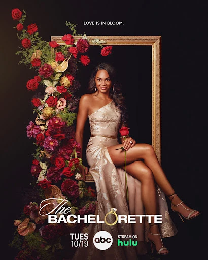 Promotional image for The Bachelorette television show featuring a smiling woman in a dress, holding a rose, and framed by flowers.