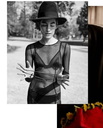 Monochrome portrait of a person in a wide-brim hat and sheer mesh top holding strings, shot by Stefano Galuzzi.