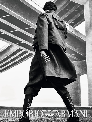 Fashion shot featuring a person in a checkered coat and boots, with 'Classic' written on the boots, set against an abstract geometric background.