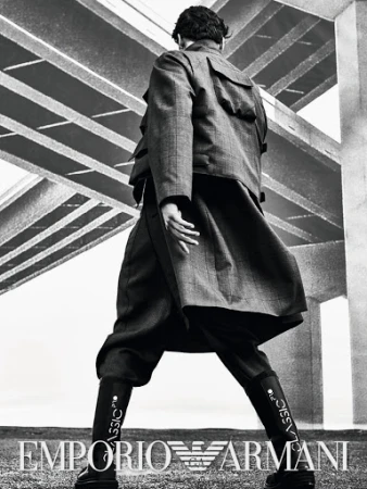 Fashion shot featuring a person in a checkered coat and boots, with 'Classic' written on the boots, set against an abstract geometric background.