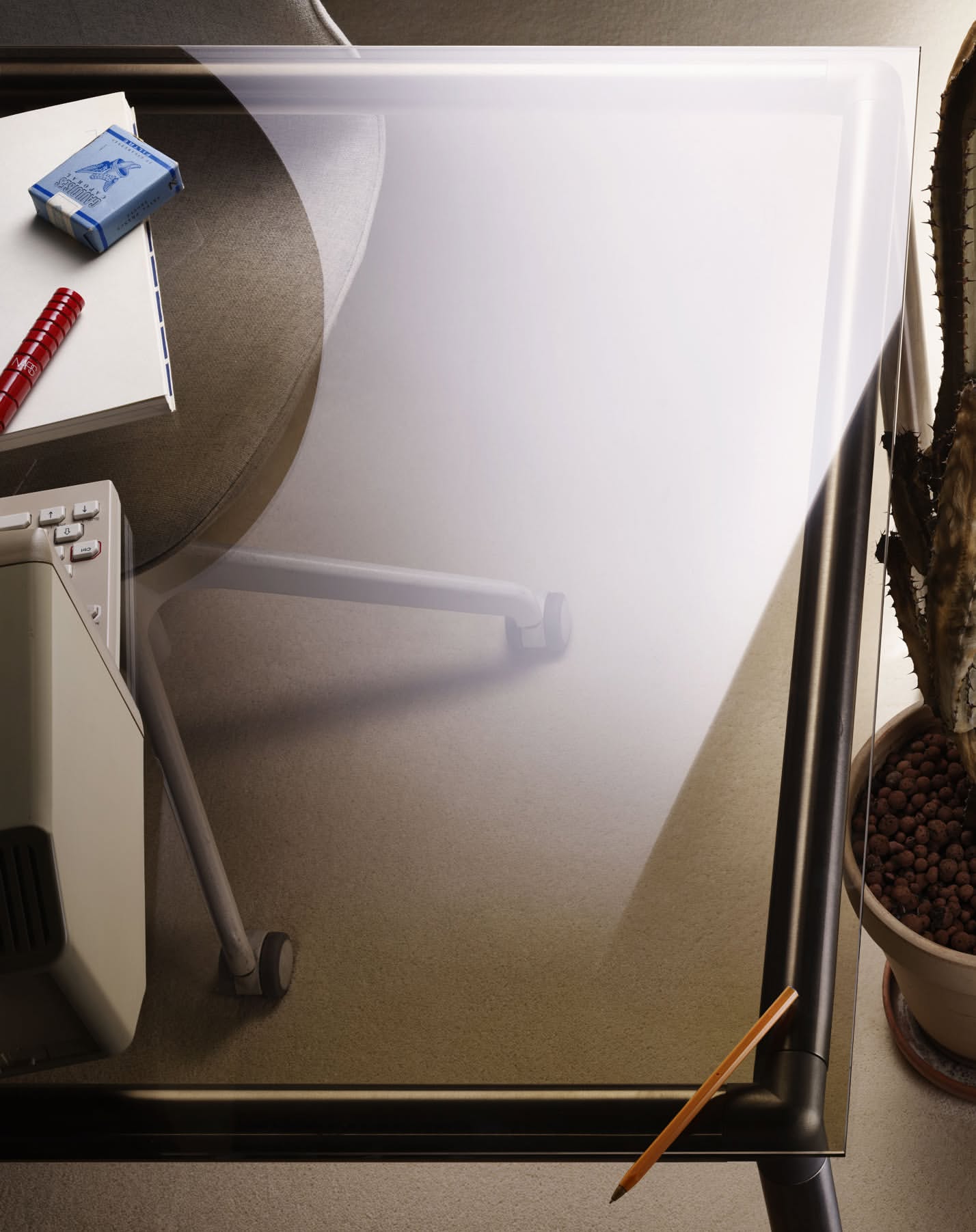 Overhead shot of a clear glass desk with assorted office supplies including notebook, pen, pencil, and potted cactus plant.