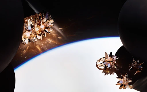 Elegant fashion jewelry featuring crystal-encrusted ring and cuff bracelet in a luxury setting with dynamic lighting and black orb props.
