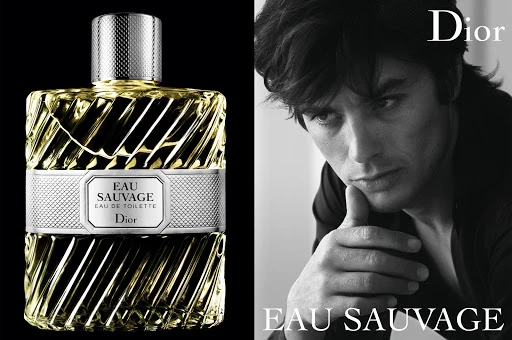 Dior Eau Sauvage fragrance ad: perfume bottle in focus, contrasted with a black and white portrait of a man. Elegant and classic.
