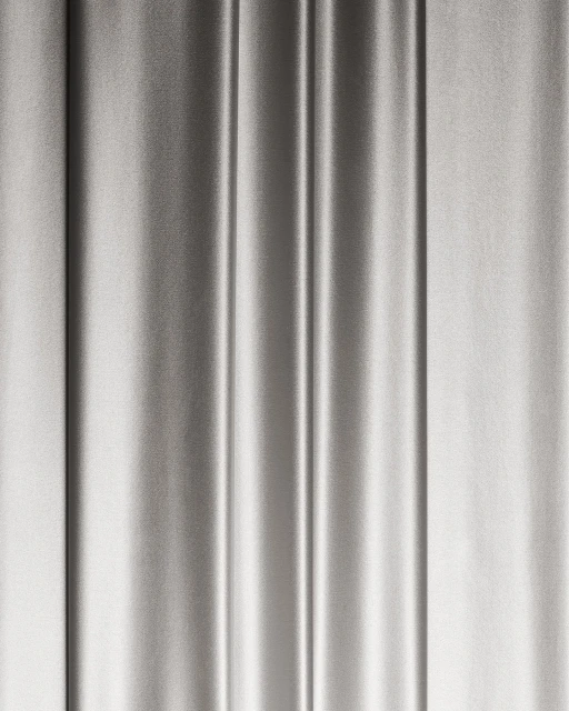 Elegant silver satin fabric drapes vertically with soft folds and subtle sheen, perfect for backdrops and luxurious textures.