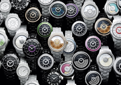 Collection of elegant Dior women's wristwatches with diamond and jewel embellishments in black, white, silver, and gold tones on a dark surface.