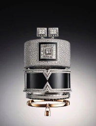 Stacked luxury diamond and black lacquer bracelets with a small dangling padlock photographed by Thomas Legrand