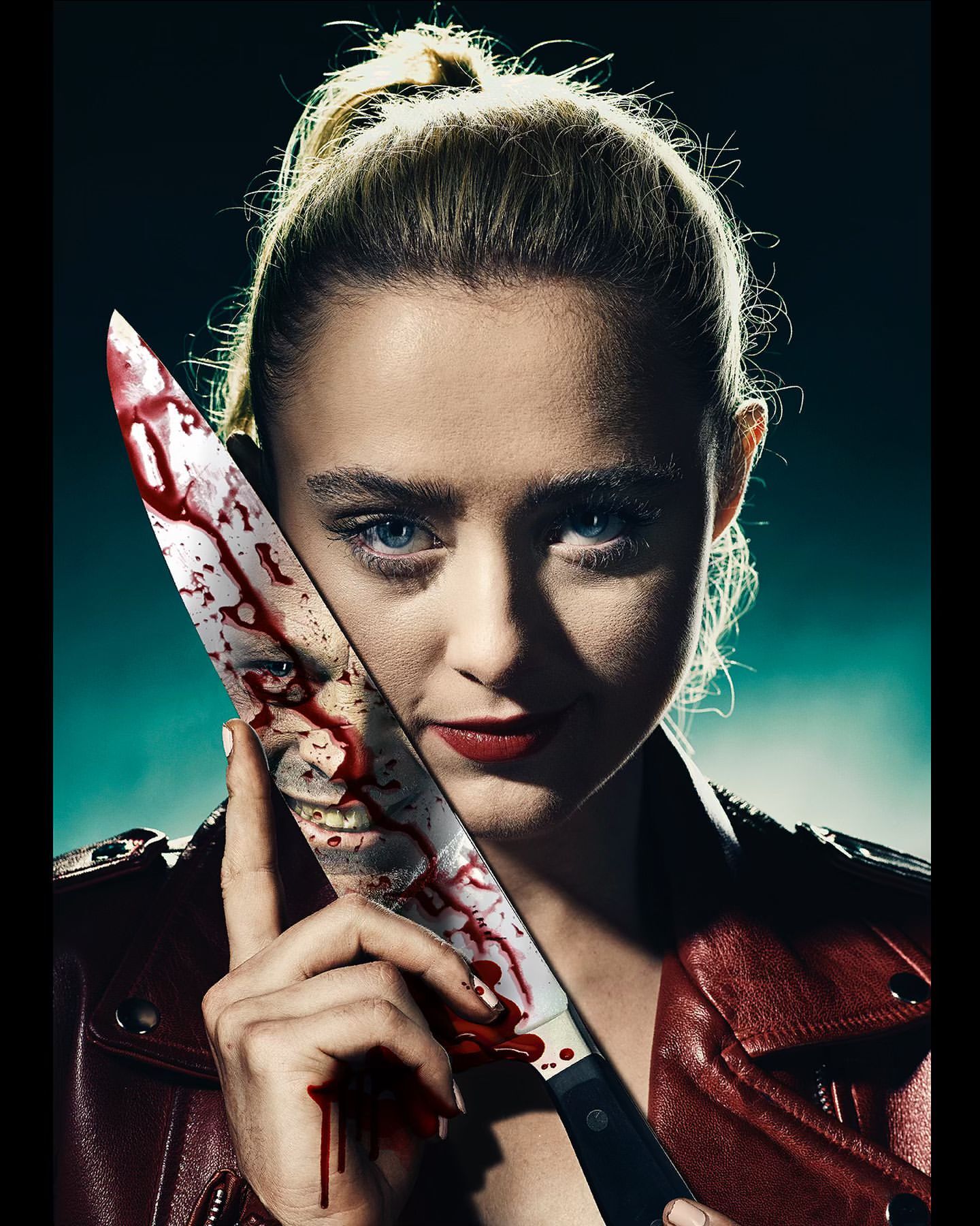 Blonde woman in red leather jacket holds blood-covered knife, smiling in a portrait shot with dark lighting, close-up view.