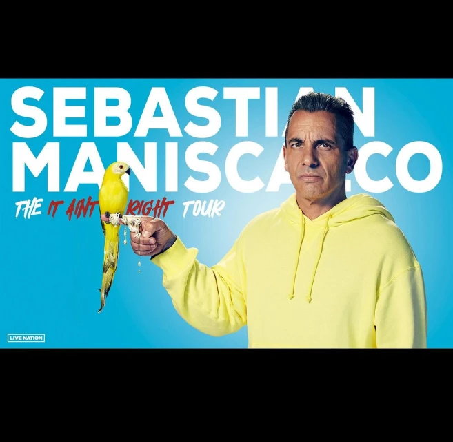 Promotional image of Sebastian Maniscalco with a yellow parrot perched on his hand, set against a bright blue backdrop with event branding.