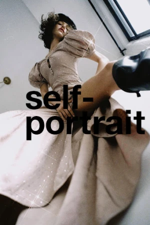 Low-angle fashion portrait of a woman in a beige puffed-sleeve dress and dark beret with bold overlaid text.