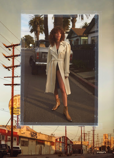 Woman with curly hair posing on city street in a beige trench coat and tan boots, framed within an aesthetic composite image.