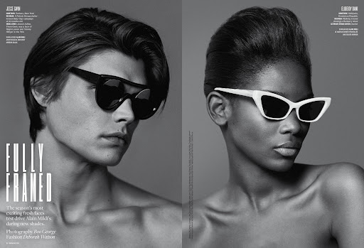 Black and white fashion shot of a Caucasian male and Black female wearing sunglasses, showcasing accessories and studio lighting.