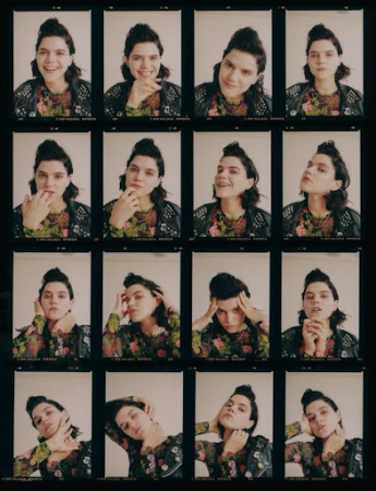 Multiple film photographs of a brunette woman with varied poses, captured in a photo booth style, set against a dark background.