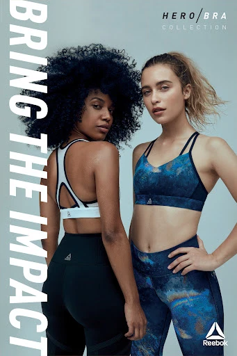 Two athletic women in sports bras and leggings pose for a fitness campaign. One woman has afro hair, and the other has blonde hair.