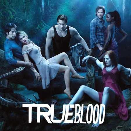 Promotional image for True Blood featuring seven people posing in a forest setting with a wolf and the show's logo at the bottom.