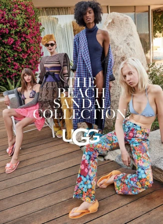 A diverse group of four fashion models in swimwear and UGG sandals poses outdoors on a wooden deck with blooming flowers in the background.