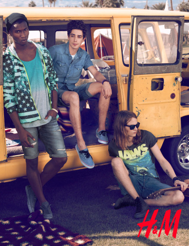 Three young adult models pose outdoors with a vintage yellow van, wearing casual summer fashion, captured on a sunny day for an H&M advertisement.
