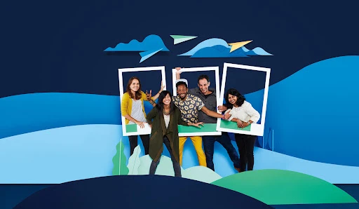 Group of diverse people posing inside cardboard frames set against a layered blue papercraft landscape by Dane Johnson