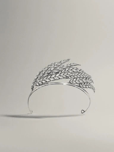Elegant diamond tiara featuring a wheat design, set against a neutral background, emphasizing luxury and craftsmanship for editorial use.