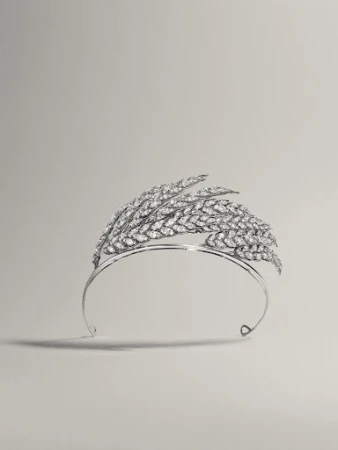Elegant diamond tiara featuring a wheat design, set against a neutral background, emphasizing luxury and craftsmanship for editorial use.