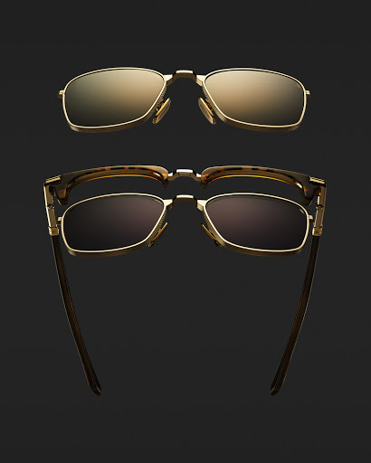 Two pairs of rimless sunglasses with gold frames are displayed against a dark background, showcasing eyewear fashion.