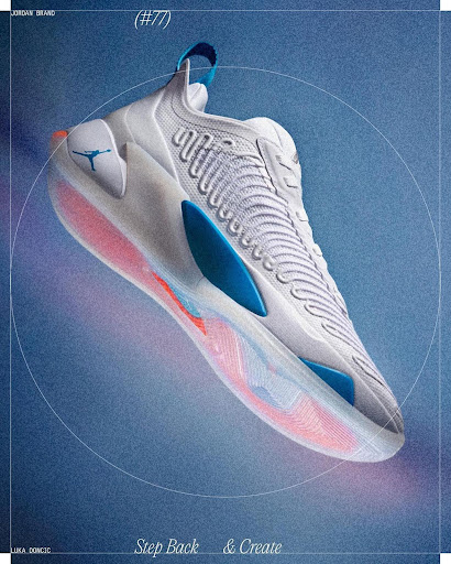 Close-up studio shot of a white and blue Luka Doncic Jordan brand basketball shoe set against a textured blue and purple gradient background.