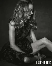 Monochrome portrait of Nicole Kidman seated wearing a dark halter dress, styled by James Dean.