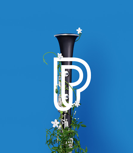 Stylized still life featuring a clarinet adorned with greenery and white flowers, set against a vibrant blue background.
