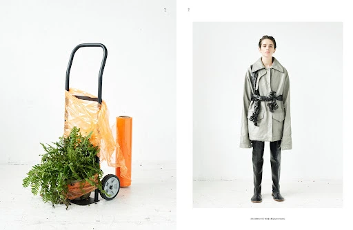 A fashion editorial showcases a model in an oversized grey jacket and black boots against a white backdrop, and a shopping trolley with plants.