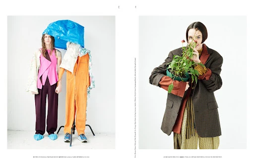Two fashion models pose in a photo studio wearing designer clothes with an emphasis on unconventional styling and creative direction.
