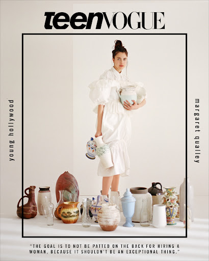 Teen Vogue cover featuring Margaret Qualley in a white dress surrounded by an array of vases and pottery in a brightly lit photo studio.