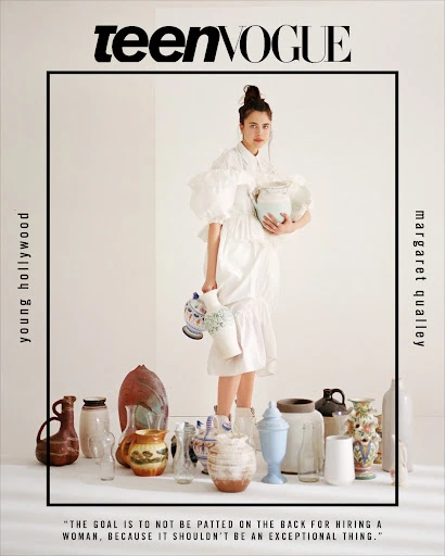 Teen Vogue cover featuring Margaret Qualley in a white dress surrounded by an array of vases and pottery in a brightly lit photo studio.