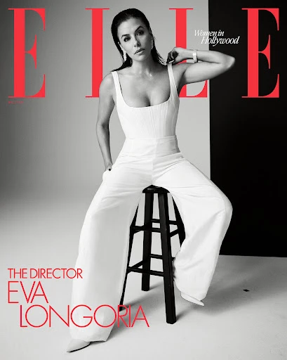 Elle magazine cover featuring Eva Longoria in a white jumpsuit sitting on a stool against a black and grey background.