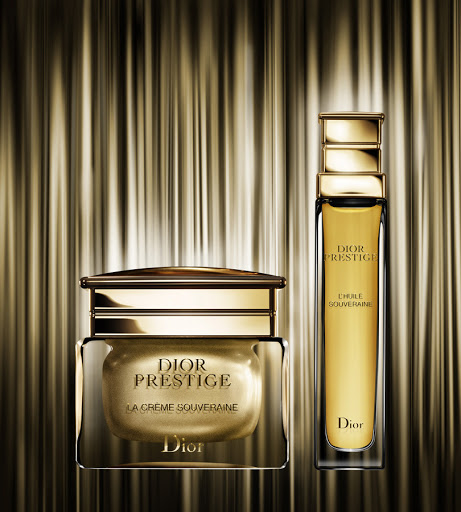 Dior Prestige skincare products in gold and glass, including La Crème Souveraine and l'Huile Souveraine, set against a textured gold backdrop.