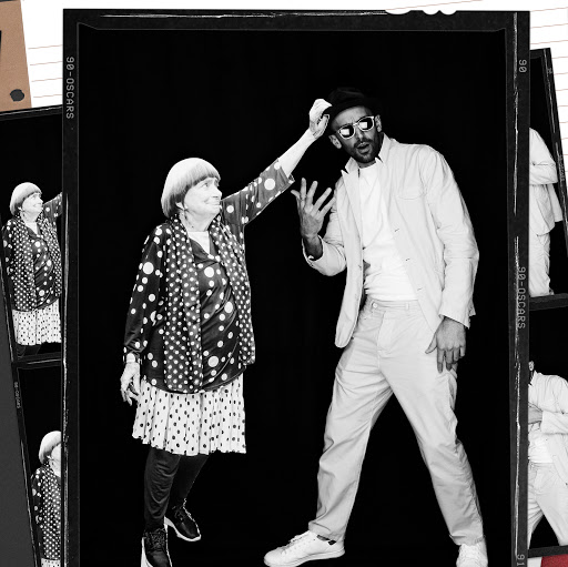 Black and white portrait of an elderly woman in a polka dot dress and a man wearing sunglasses and a hat with prop styling by Maxim Jezek.