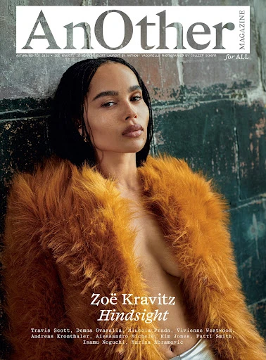 Zoë Kravitz magazine cover: AnOther Magazine. Adult female in a fur coat poses against a wall. Magazine text and logos are visible.