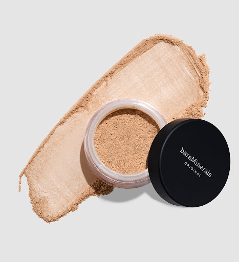 BareMinerals Original foundation in open jar with lid on a gray background. Loose powder foundation for face makeup.